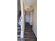 Modern hallway with dark wood-look floors and stairs at 639 W Pepper Pl # 107, Mesa, AZ 85201