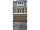Tan garage door and second-story balcony at 639 W Pepper Pl # 107, Mesa, AZ 85201