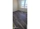 Spacious bedroom with large windows and gray flooring at 639 W Pepper Pl # 107, Mesa, AZ 85201