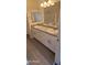 Double vanity bathroom with modern light fixture at 639 W Pepper Pl # 107, Mesa, AZ 85201