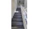 Modern staircase with gray wood-look flooring at 639 W Pepper Pl # 107, Mesa, AZ 85201