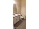 Simple bathroom with white vanity and gray tile floor at 639 W Pepper Pl # 107, Mesa, AZ 85201