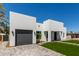 Modern home with artificial turf, gray driveway, and walkway at 3014 E Avalon Dr, Phoenix, AZ 85016