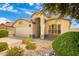 House exterior featuring a two-car garage and neatly landscaped front yard at 3817 E Irma Ln, Phoenix, AZ 85050