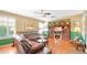 Comfortable living room with leather sofa and built-in fireplace at 6574 S Crestview Dr, Gilbert, AZ 85298