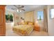 Bedroom with a floral comforter and plenty of natural light at 6574 S Crestview Dr, Gilbert, AZ 85298