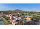 Aerial view of community pool, water slide, and golf course at 6574 S Crestview Dr, Gilbert, AZ 85298