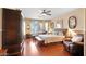Spacious main bedroom with hardwood floors and large windows at 6574 S Crestview Dr, Gilbert, AZ 85298