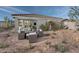 Relaxing patio with seating area and desert landscaping at 2808 W Monte Way, Laveen, AZ 85339