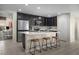 Modern kitchen featuring dark cabinetry and an island at 2804 W Monte Way, Laveen, AZ 85339