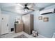 Spacious laundry room with built-in cabinets and tile flooring at 710 W 18Th St, Tempe, AZ 85281