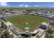 Aerial view of a baseball field with bleachers and surrounding landscape at 24355 W Jessica Ln, Buckeye, AZ 85326