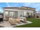 Relaxing backyard with covered patio and artificial turf at 24367 W Jessica Ln, Buckeye, AZ 85326