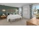 Spacious main bedroom with green accent wall and stylish decor at 24367 W Jessica Ln, Buckeye, AZ 85326