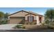 One-story home with a two-car garage and landscaping at 24367 W Jessica Ln, Buckeye, AZ 85326