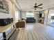 Living room with gray couch, wood-look floors and fireplace at 318 S Crismon Rd # 10, Mesa, AZ 85208