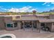 Covered patio with seating area, mountain views, and terracotta roof at 4755 S Pura Vida Way, Gold Canyon, AZ 85118