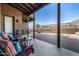 Relaxing covered patio with seating and mountain views at 4755 S Pura Vida Way, Gold Canyon, AZ 85118