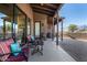 Covered patio with seating area and access to interior at 4755 S Pura Vida Way, Gold Canyon, AZ 85118