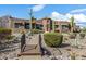 Landscaped pathway to a Southwestern style home; bridge feature at 4755 S Pura Vida Way, Gold Canyon, AZ 85118