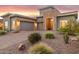 Modern home with stone accents and desert landscaping at 9844 E June St, Mesa, AZ 85207