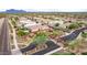 Aerial view of a community with houses and a mountain backdrop at 9844 E June St, Mesa, AZ 85207