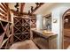 Large wine storage room with wooden racks and stainless steel appliances at 23832 N 112Th Pl, Scottsdale, AZ 85255
