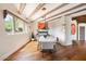 Bright dining room with hardwood floors and wood beams at 23832 N 112Th Pl, Scottsdale, AZ 85255