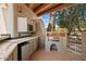 Outdoor kitchen with built-in grill, mini-fridge, and tile countertops at 23832 N 112Th Pl, Scottsdale, AZ 85255