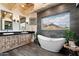 Bathroom with freestanding tub and mountain views at 23832 N 112Th Pl, Scottsdale, AZ 85255