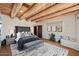 Main bedroom with wood beam ceiling, comfy bed, and neutral decor at 23832 N 112Th Pl, Scottsdale, AZ 85255