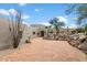 Brick paved driveway leading to a stucco home with desert landscaping at 23832 N 112Th Pl, Scottsdale, AZ 85255