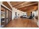 Open living area with hardwood floors and wood beam ceilings at 23832 N 112Th Pl, Scottsdale, AZ 85255