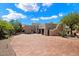 Stucco home with brick driveway and desert landscape at 23832 N 112Th Pl, Scottsdale, AZ 85255