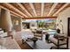 Outdoor patio with seating area, fireplace, and mountain views at 23832 N 112Th Pl, Scottsdale, AZ 85255