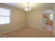 Spacious dining area with neutral colored walls and carpet at 43303 W Courtney Dr, Maricopa, AZ 85138