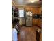 Eat-in kitchen with wood cabinets and appliances at 6321 N 65Th Dr, Glendale, AZ 85301