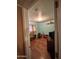 Third bedroom with wood-look floors, brick walls, and a desk at 6321 N 65Th Dr, Glendale, AZ 85301
