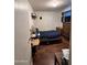 Bright bedroom with a double bed, dresser, and wood-look floors at 6321 N 65Th Dr, Glendale, AZ 85301