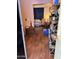 View into living room from kitchen area, showing wood-look floors and open concept at 6321 N 65Th Dr, Glendale, AZ 85301