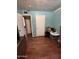 Simple bedroom with wood flooring and light walls at 6321 N 65Th Dr, Glendale, AZ 85301