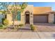 Modern home exterior with attractive landscaping and two-car garage at 729 E Cobble Stone Dr, San Tan Valley, AZ 85140