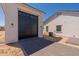 Detached garage with herringbone driveway and modern design at 6828 N 177Th Pl, Waddell, AZ 85355