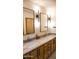 Double vanity bathroom with modern light fixtures and marble at 13061 N 80Th Pl, Scottsdale, AZ 85260