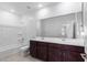 Bathroom boasts double vanity and a bathtub at 17975 W Vogel Ave, Goodyear, AZ 85338