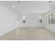 Bright and airy living room with light wood floors and recessed lighting at 17975 W Vogel Ave, Goodyear, AZ 85338