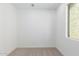 Small bedroom with carpeted floors and a window at 17975 W Vogel Ave, Goodyear, AZ 85338