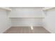 Large walk-in closet with double hanging rods at 17975 W Vogel Ave, Goodyear, AZ 85338