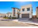 Modern two-story house with light-colored exterior and a brown garage door at 17975 W Vogel Ave, Goodyear, AZ 85338