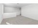 Spacious carpeted bedroom with neutral walls and access to hallway at 17975 W Vogel Ave, Goodyear, AZ 85338